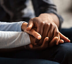 Image of a couple holding hands