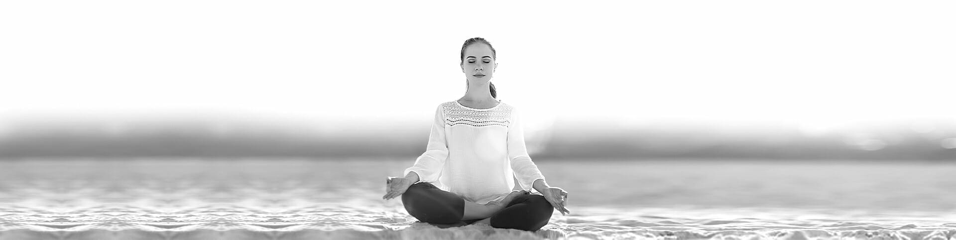 Image of a woman practicing yoga, utilizing her coping skills for addic