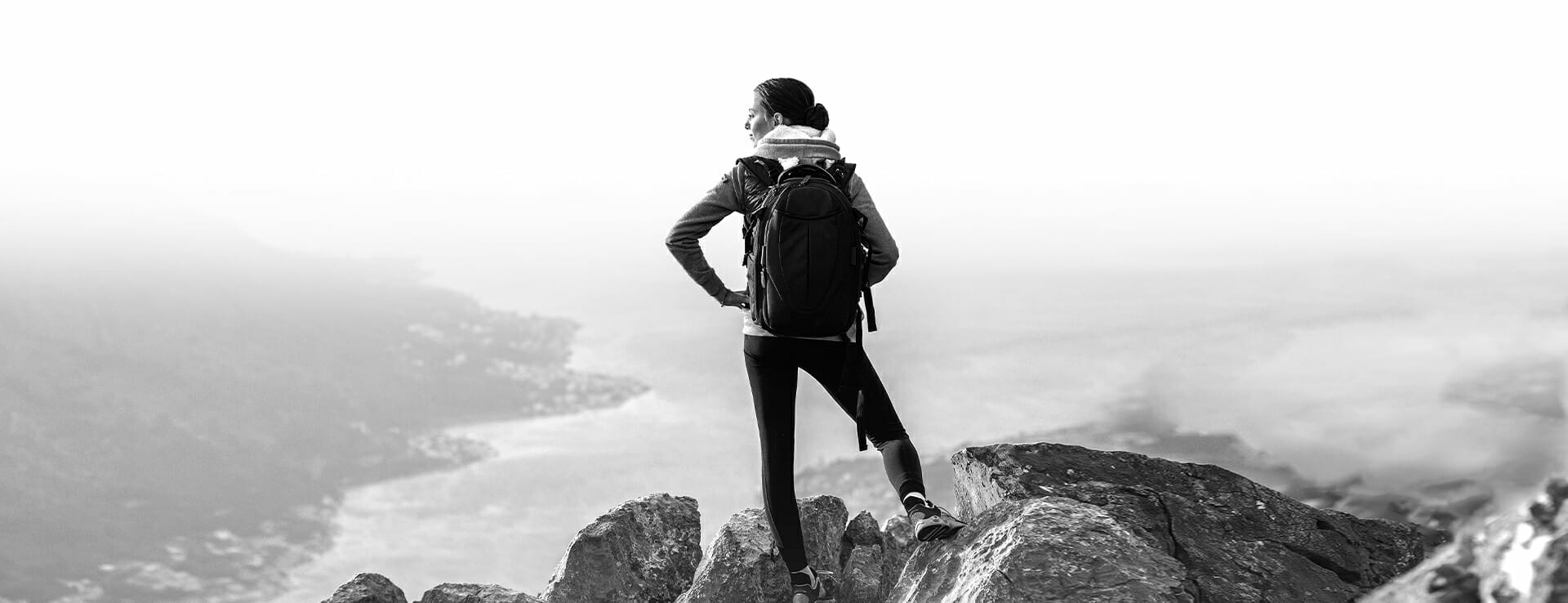 Image of a woman hiking outdoors, starting her new life with the help of substance use disorder treatment