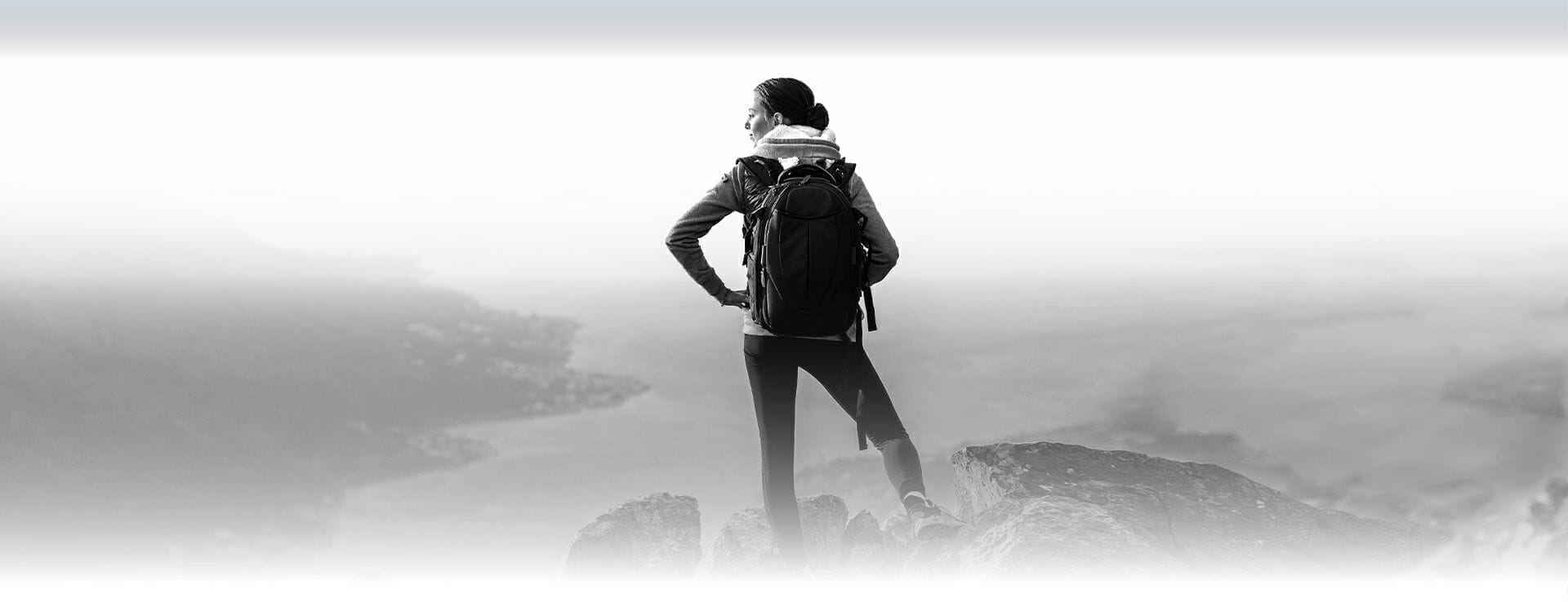 Image of a woman hiking outdoors, starting her new life with the help of substance use disorder treatment